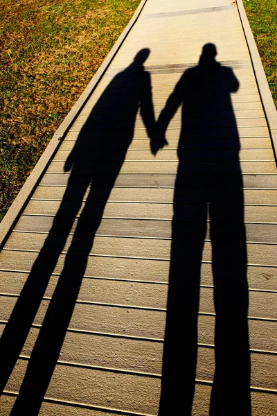 Shadow Couple Holding Hands Sidewalk Boardwalk Love — Stock Photo, Image