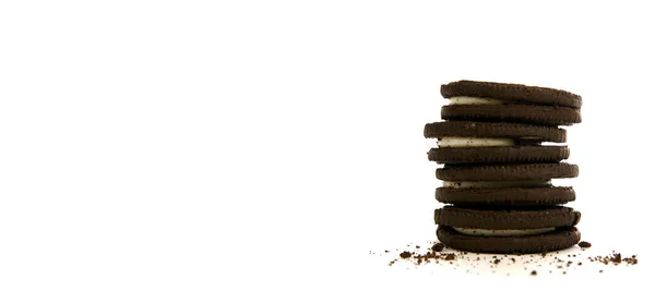 Chocolate Cookies Creme Filling Crumbs White Background Panorama Style — Stock Photo, Image