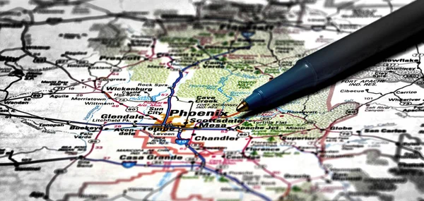 Closeup map of city Phoenix for travel destination driving with pen