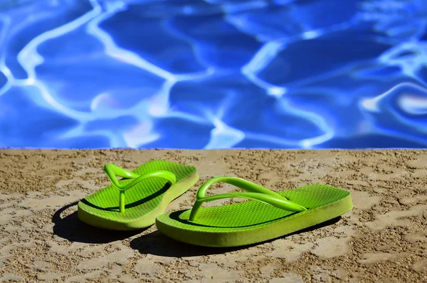 Flip Flops Sandals by Swimming Pool — Stock Photo, Image