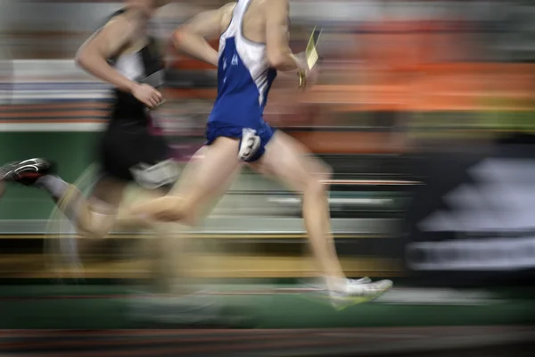 Running a Relay Race on Tract Holding Baton — Stock Photo, Image