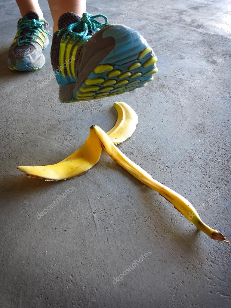 Detail of Person Stepping on Banana Peel and Slipping — Stock Photo