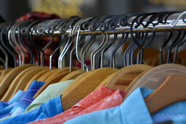 Hangers on pole for hanging clothing in closet storage Royalty Free Stock Photos