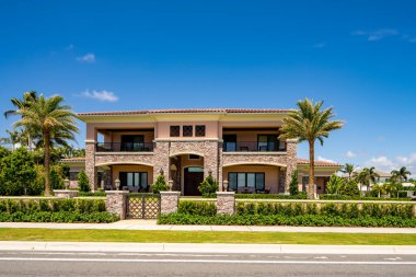 West Palm Beach, FL, USA - May 22, 2021: Photo of a luxury single family house in West Palm Beach Florida USA clipart