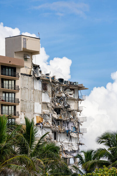 Miami Beach Surfside, FL, USA - June 26, 2021: Champlain Towers remains 2 days after collapse owners personal belongings visible hanging from the units