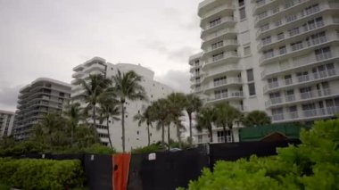 Motion video east view Champlain Towers Surfside Miami dunes in foreground