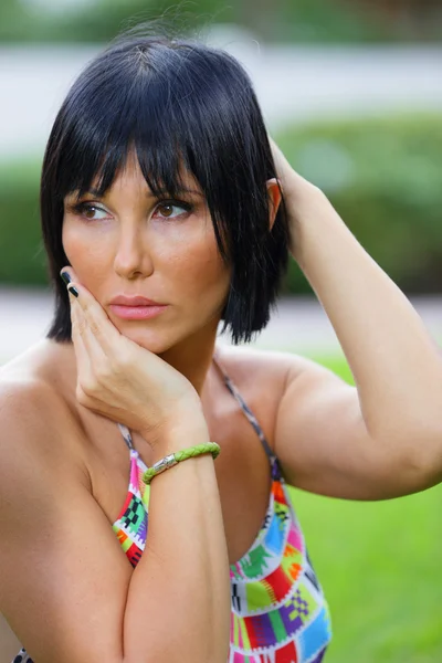 Woman with hands on her head — Stock Photo, Image