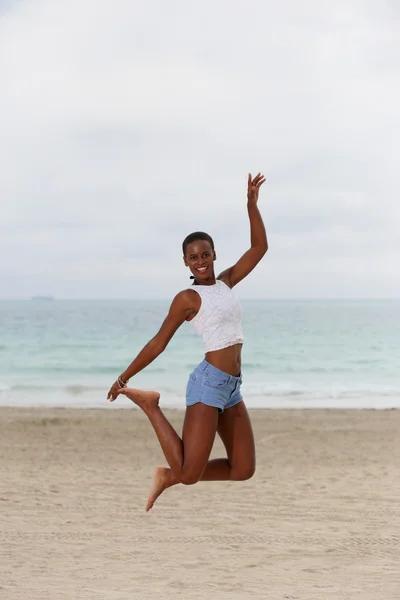 Woman jumping in midair — Stock Photo, Image