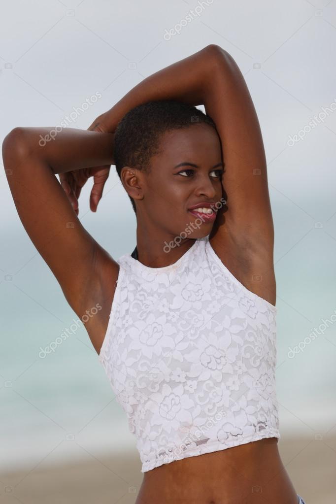 Women posing with her arms above her head Stock Photo by ©felixtm
