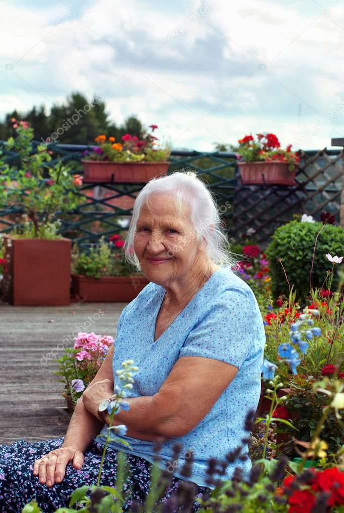 Elderly woman in garden