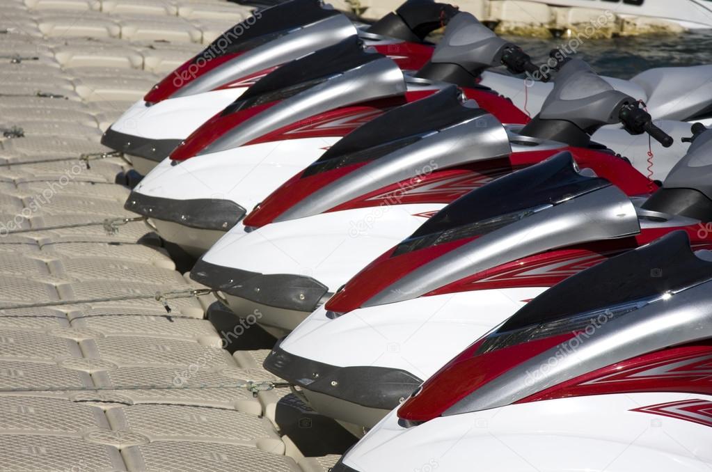 Group of Jet Skis on Dock