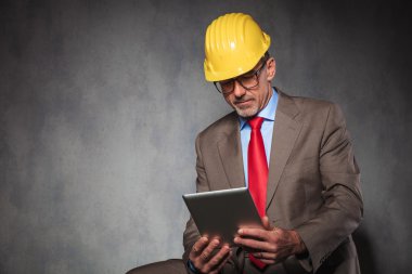 entrepreneur wearing helmet and glasses while seated