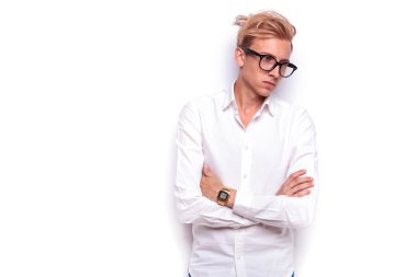 sexy hipster posing with hands crossed while wearing glasses