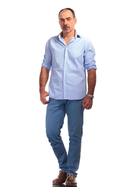 Elegant mature man with open shirt posing hands down — Stok fotoğraf