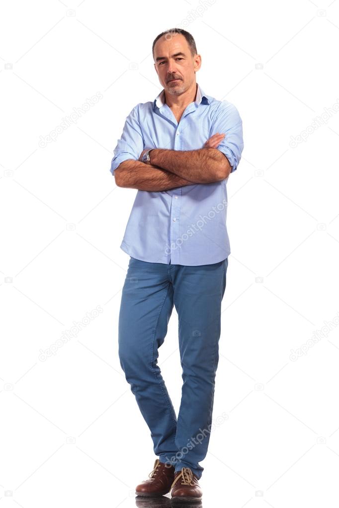handsome mature casual man posing with hands crossed