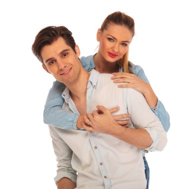 beautiful girl embracing man from behind