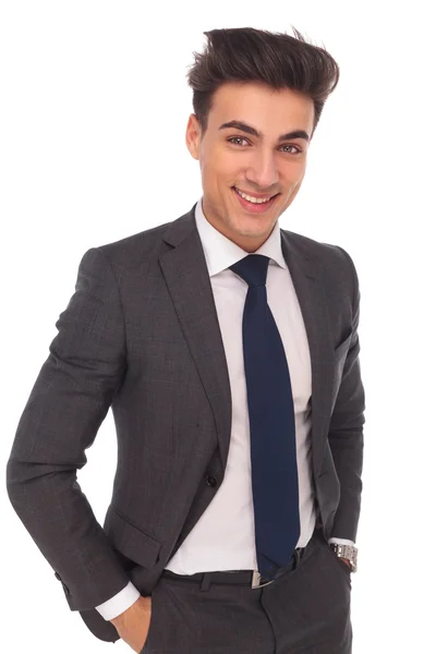 Happy young business man with hands in pockets — Stock Photo, Image