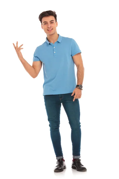 Man in blue shirt pointing fingers — Stock Photo, Image