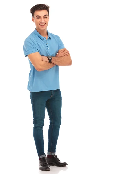 Hipster in blue shirt posing with arms crossed — Stock Photo, Image