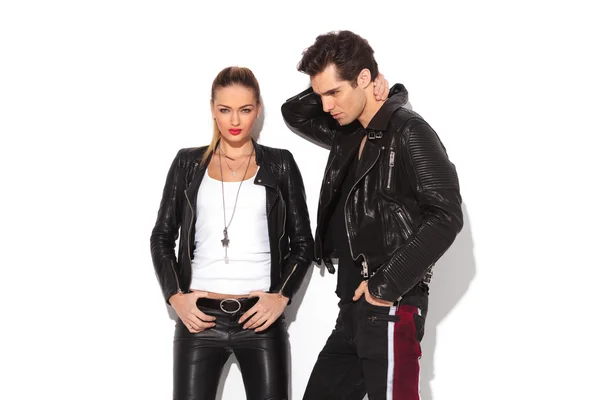 Hot young couple in leather clothes — Stok fotoğraf