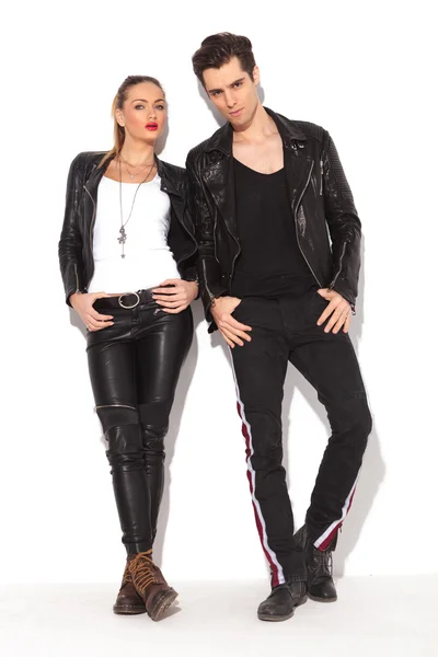 Young sexy couple in leather jackets posing — Stok fotoğraf