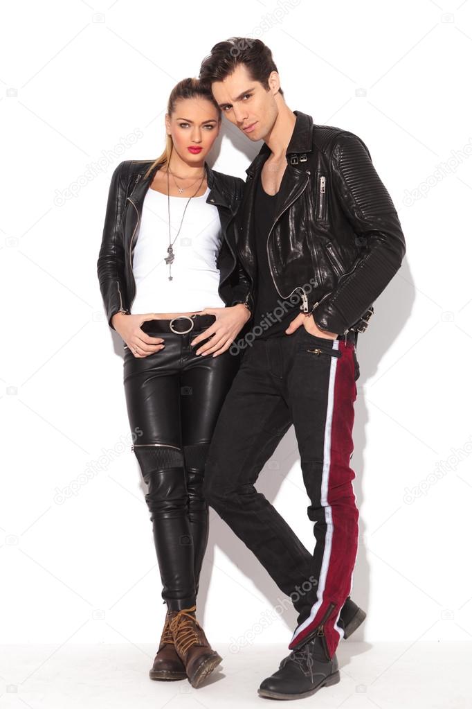 rock and roll couple in leather clothes standing together