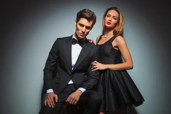 Elegant couple in black posing in studio — Stock Photo, Image