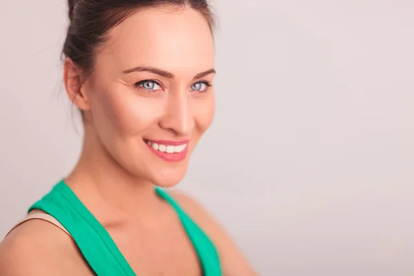 Side of a smiling woman's face looking away — Stock Photo, Image