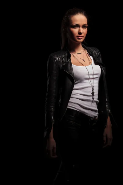 Sexy woman in leather jacket and undershirt standing — Stock Photo, Image