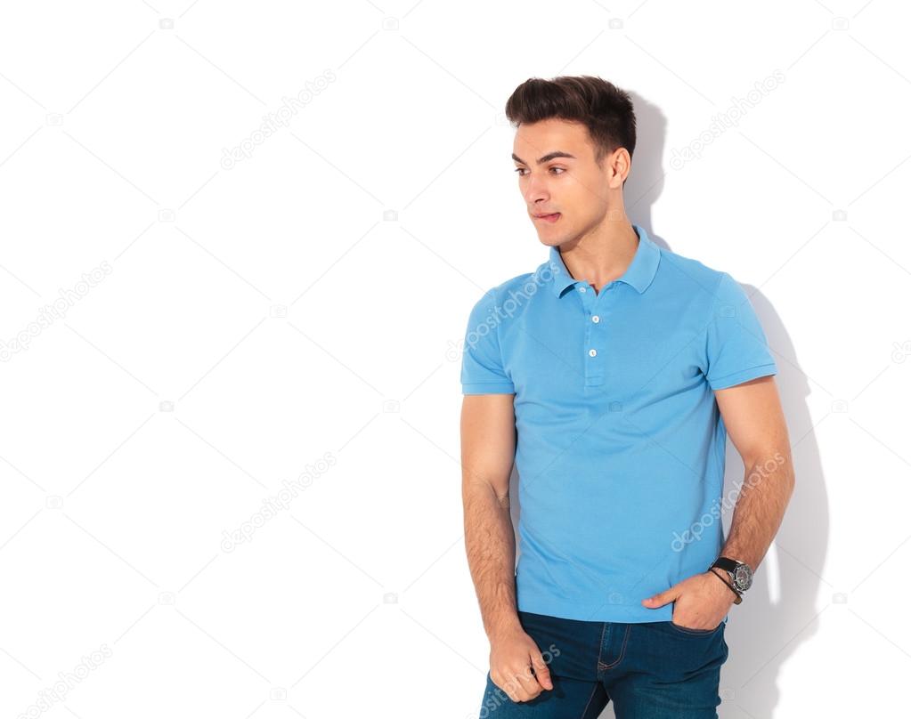 anxious man biting his lip and looks to a side