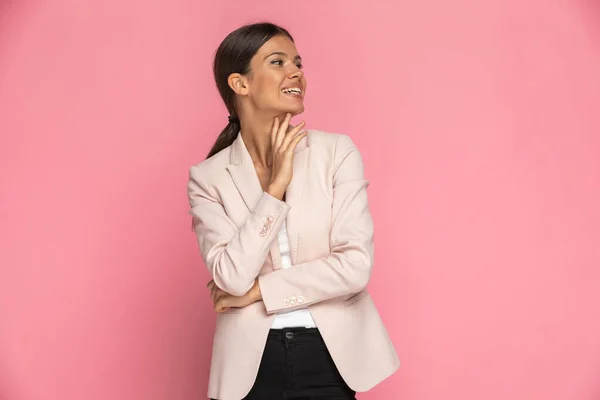 Attractive Businesswoman Touching Her Chin Looking Her Side Smiling Pink — Stock Photo, Image
