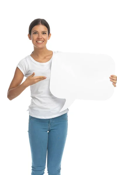 Positive Casual Woman Smiling Presenting Speech Bubble While Standing White — Stock Photo, Image