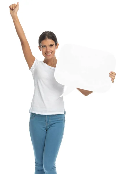 Cheerful Casual Woman Celebrating Holding Speech Bubble While Standing White — Stock Photo, Image