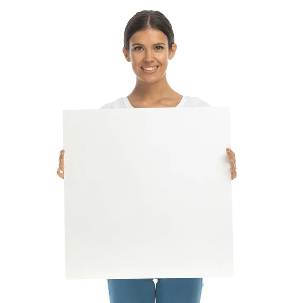 Happy Casual Woman Smiling Holding Billboard While Standing White Studio — Stock Photo, Image