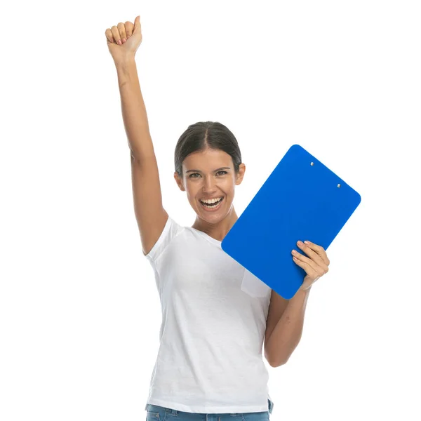 Cheerful Casual Woman Holding Clipboard Celebrating While Standing White Studio — Stock Photo, Image