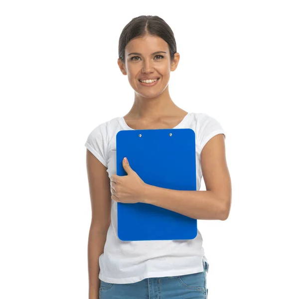 Positive Casual Woman Holding Clipboard Smiling While Standing White Studio — Stock Photo, Image