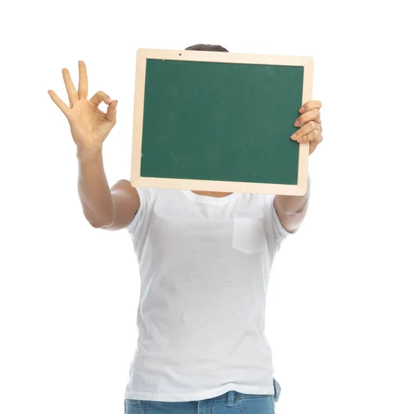 Positive Casual Woman Covering Her Face Blackboard Gesturing Perfect While — Stock Photo, Image