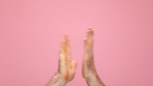 Man Holding Arms Air Pointing Fingers Applauding Pink Background Studio — Vídeos de Stock