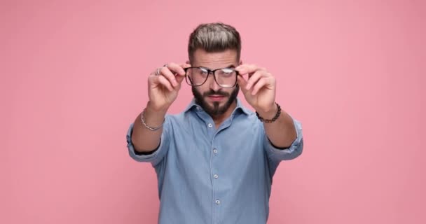 Casual Attractive Man Looking Trough His Eyeglasses Putting Them Smiling — Stockvideo