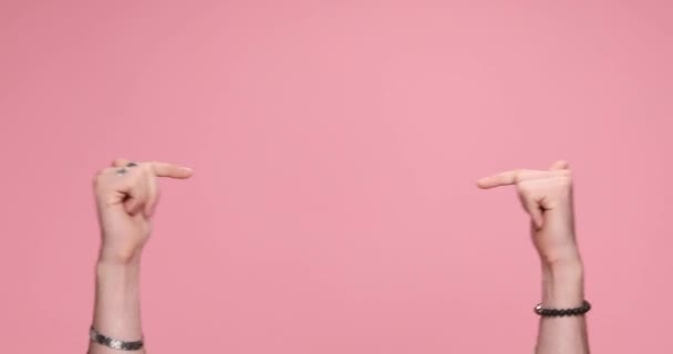 Two Hands Pointing Each Other Giving Thumbs Pink Background — Vídeos de Stock