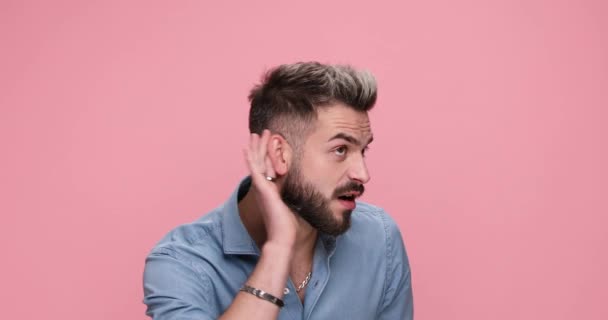 Sexy Casual Man Focusing Hear Gossip Feeling Surprised Againts Pink — Stock Video
