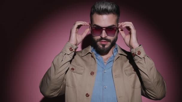 Fashion Cool Guy Denim Shirt Adjusting Beige Jacket Taking Glasses — Stock Video