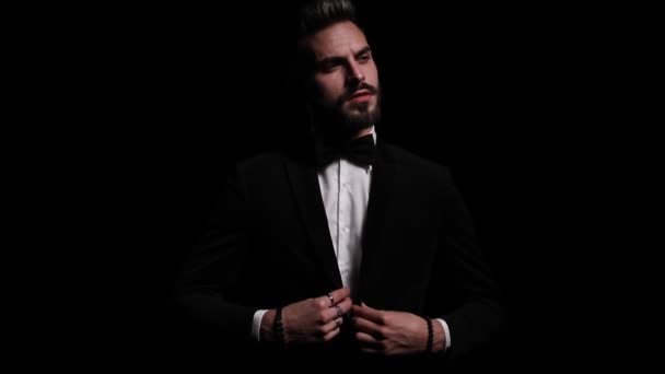 Sexy Young Businessman Buttoning Black Tuxedo Crossing Arms Looking Side — Stock Video