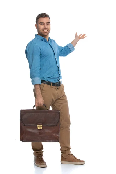 Handsome Casual Man Presenting Something Aside Holding Briefcase White Background — Stock Photo, Image