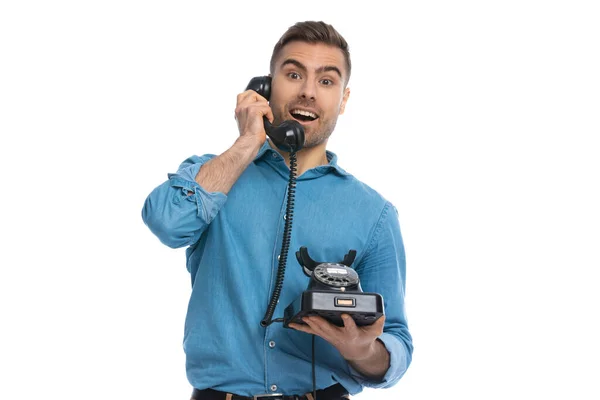 Happily Surprised Casual Man Talking Old Telephone White Background — Stock Photo, Image