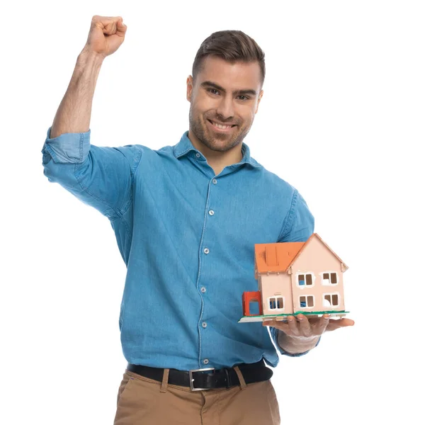 Casual Man Celebrating Succes While Holding House White Background — Stock Photo, Image