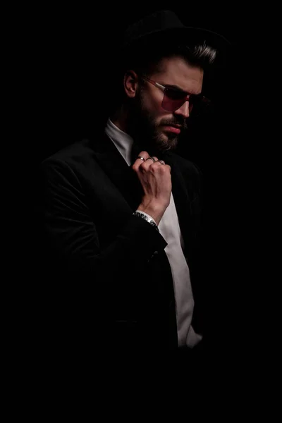 Dramatic Cool Man Black Velvet Tuxedo Looking Side Fixing Bowtie — Stock Photo, Image