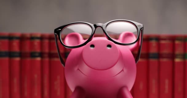 Closing Nerd Piggy Bank Wearing Glasses His Head Standing Books — Stock Video