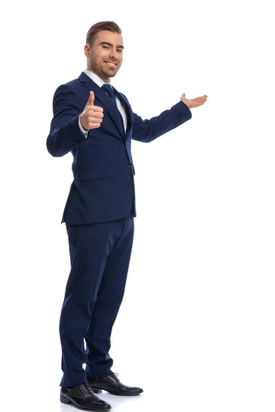 Smiling Unshaved Guy Elegant Suit Making Thumbs Sign Presenting Side — Stock Photo, Image