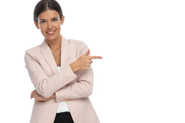 Happy Young Businesswoman Pink Jacket Pointing Finger Side Smiling White — Stock Photo, Image